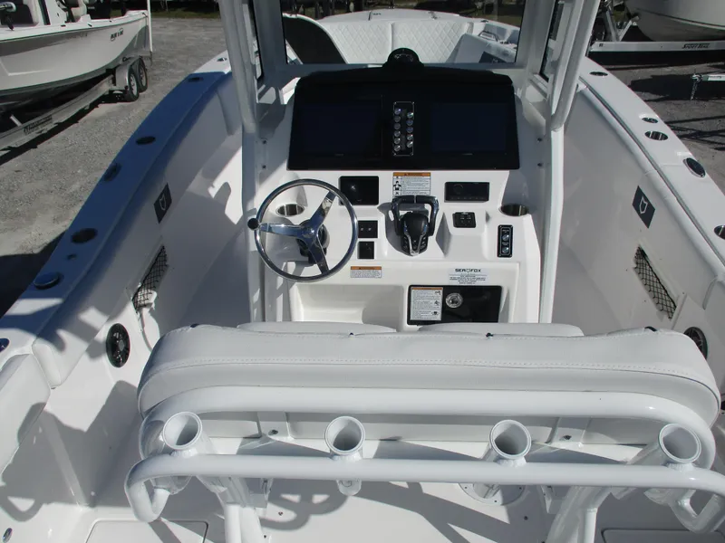 Slide: The Image of 2025 Sea Fox 268 Commander boat cockpit with steering wheel and controls. - 10
