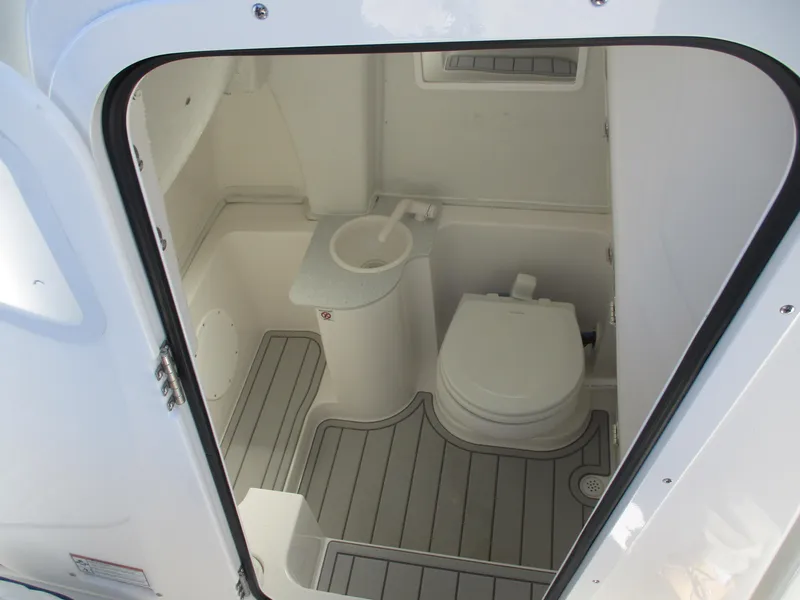 Slide: The Image of 2025 Sea Fox 268 Commander boat bathroom interior with toilet and sink. - 9