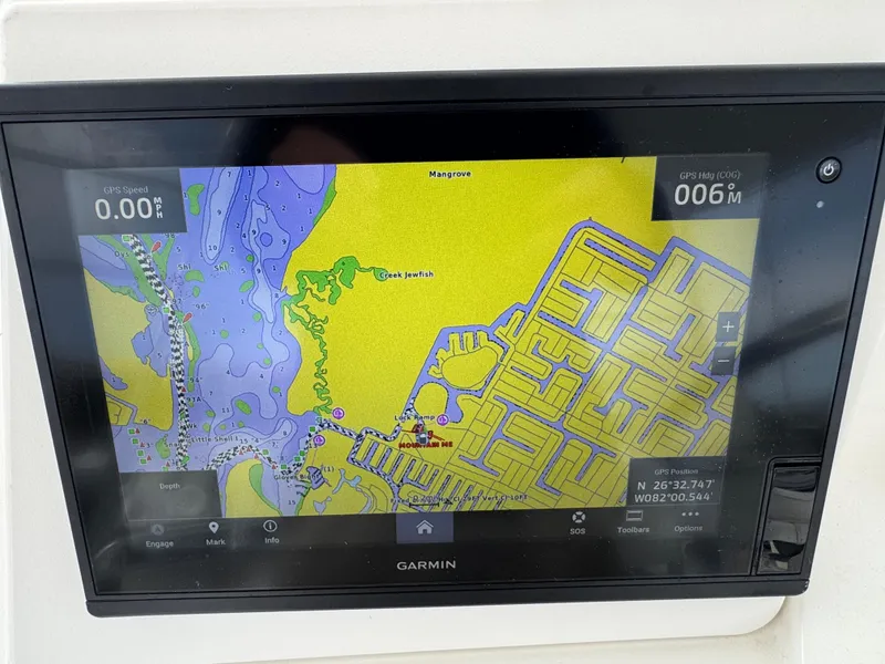 Slide: The Image of Garmin navigation display on 1999 Cabo 45 Express boat showing detailed marine map. - 29