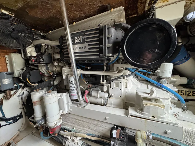 Slide: The Image of Engine room of 1999 Cabo 45 Express with CAT marine power system. - 44