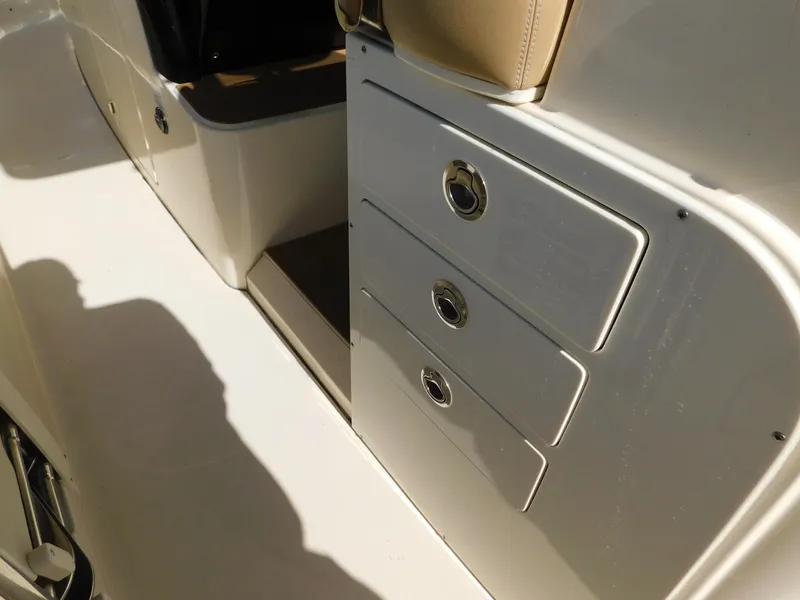 Slide: The Image of 2024 Scout 33LXF boat interior with storage drawers. - 16