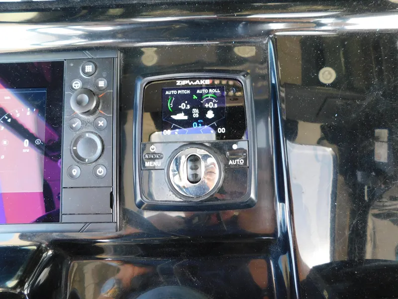 Slide: The Image of 2024 Scout 33LXF boat control panel with Zipwake auto pitch and roll system. - 20