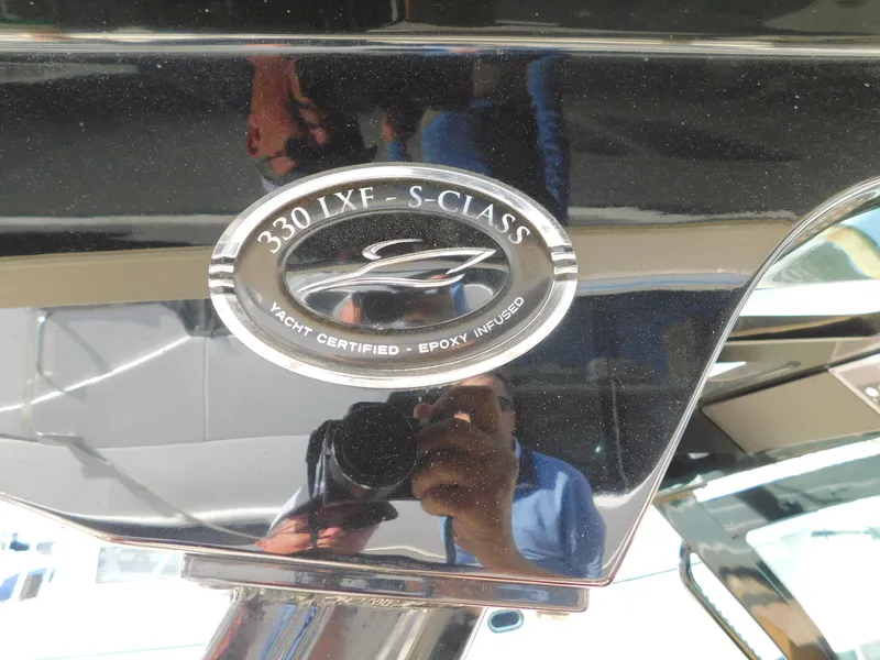 Slide: The Image of 2024 Scout 33LXF yacht emblem, featuring "330 LXF S-Class" and "Yacht Certified - Epoxy Infused." - 25