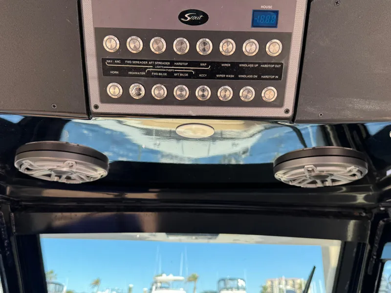 Slide: The Image of 2024 Scout 33LXF boat dashboard with control panel and speakers. - 26