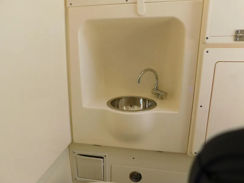 Slide: The Image of 2024 Scout 33LXF boat interior sink with modern faucet design. - 34