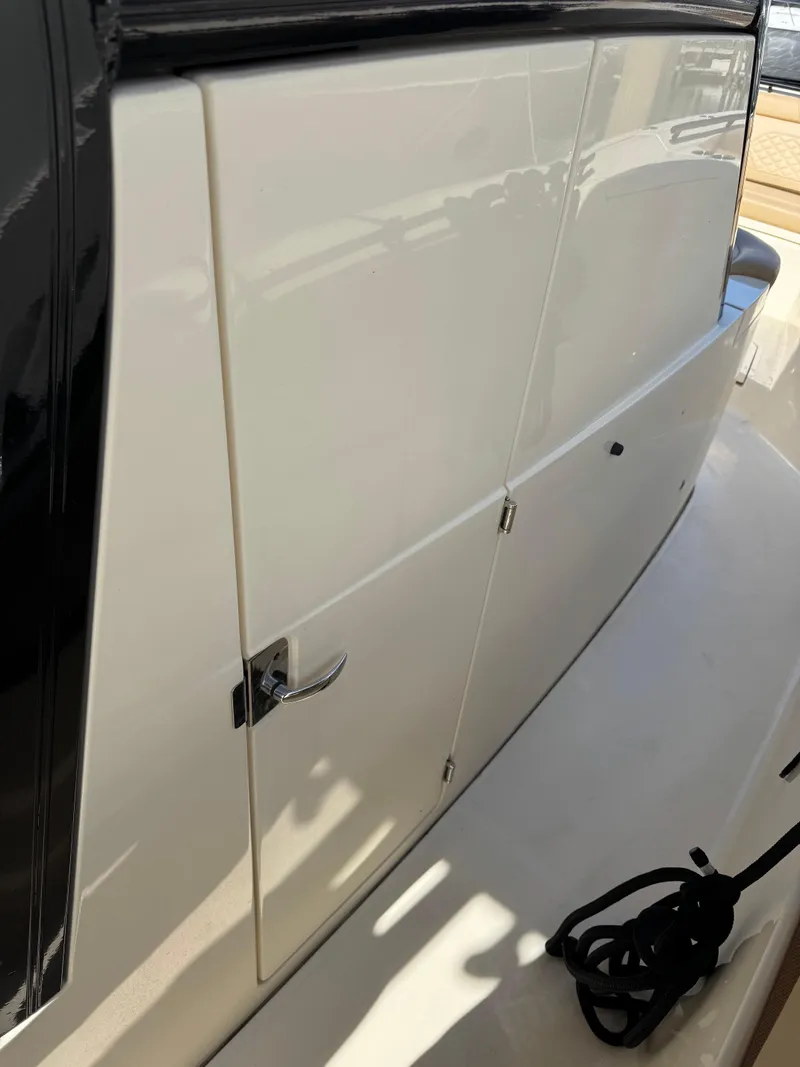 Slide: The Image of 2024 Scout 33LXF boat cabin door with sleek design and modern finish. - 36