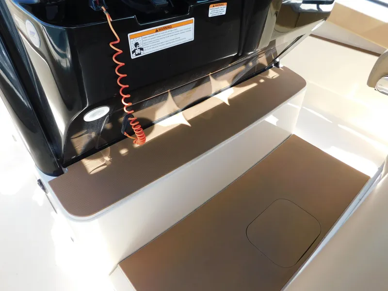 Slide: The Image of 2024 Scout 33LXF boat deck with storage compartment and safety features. - 46