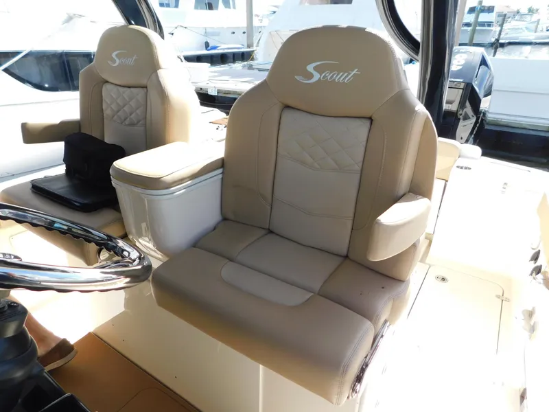 Slide: The Image of 2024 Scout 33LXF boat interior with luxurious beige seating. - 48