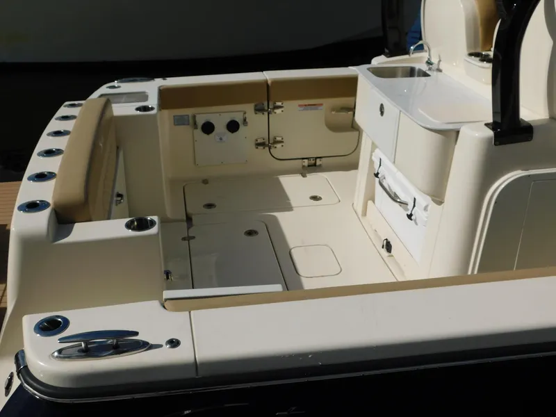 Slide: The Image of 2024 Scout 33LXF boat interior with seating and storage compartments. - 5