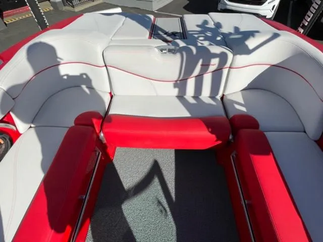 Slide: The Image of 2020 MasterCraft XT22 boat interior with red and white seating. - 14