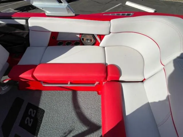 Slide: The Image of 2020 MasterCraft XT22 boat interior with red and white seating. - 15