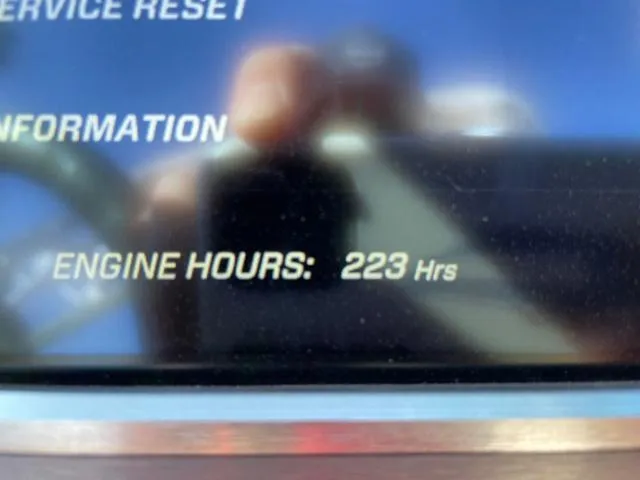 Slide: The Image of Close-up of 2020 MasterCraft XT22 display showing 223 engine hours. - 18