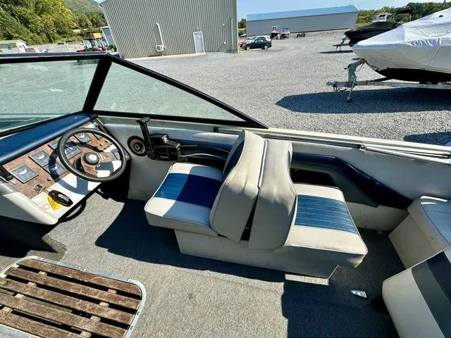 Slide: The Image of Interior of 1989 Glassport 175 BR boat with blue and white seating. - 3