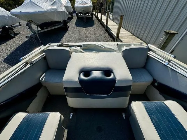 Slide: The Image of Interior of a 1989 Glassport 175 BR boat with blue and white seating. - 4