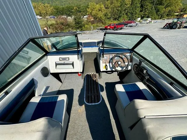 Slide: The Image of Interior of 1989 Glassport 175 BR boat with seating and steering wheel. - 8