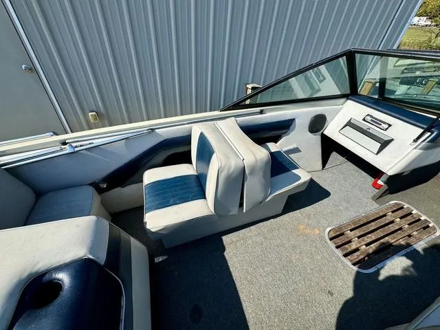 Slide: The Image of Interior of 1989 Glassport 175 BR boat with blue and white seating. - 9