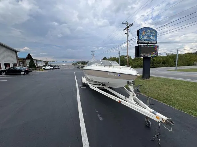 Slide: The Image of 2002 Stingray 200LS/LX boat on trailer at Full Performance Marine dealership. - 4