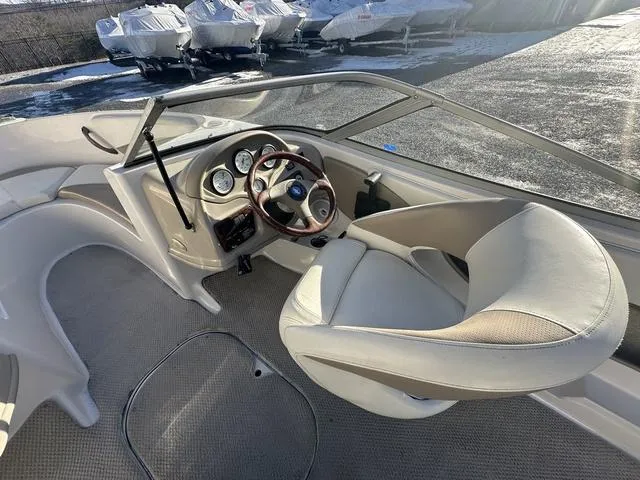 Slide: The Image of 2005 Four Winns 190 Horizon boat interior with steering wheel and dashboard. - 11