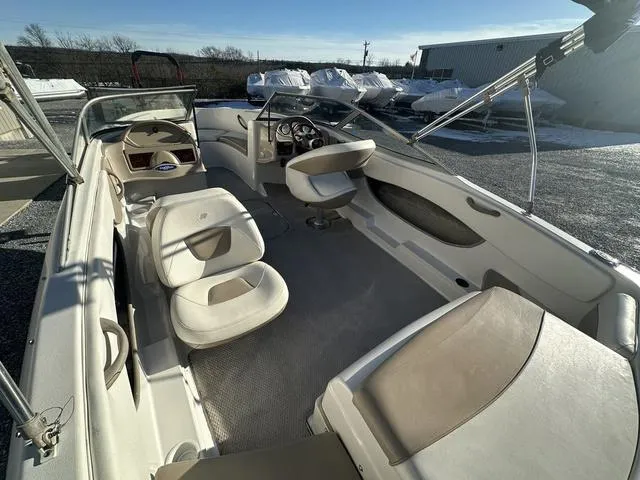 Slide: The Image of 2005 Four Winns 190 Horizon boat interior with seating and steering wheel. - 5