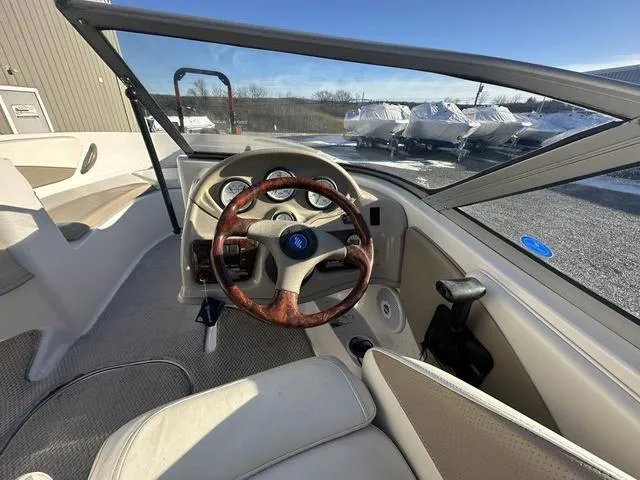 Slide: The Image of 2005 Four Winns 190 Horizon boat interior with steering wheel and dashboard. - 6