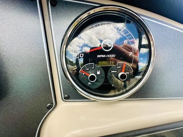 Slide: The Image of Close-up of 2022 Hurricane SunDeck 191 OB boat tachometer showing RPM and fuel gauges. - 13