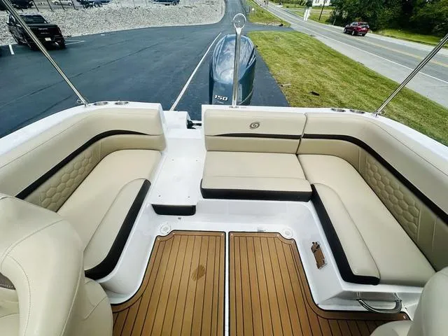 Slide: The Image of 2022 Hurricane SunDeck 191 OB boat interior with beige seating and wood-style flooring. - 14