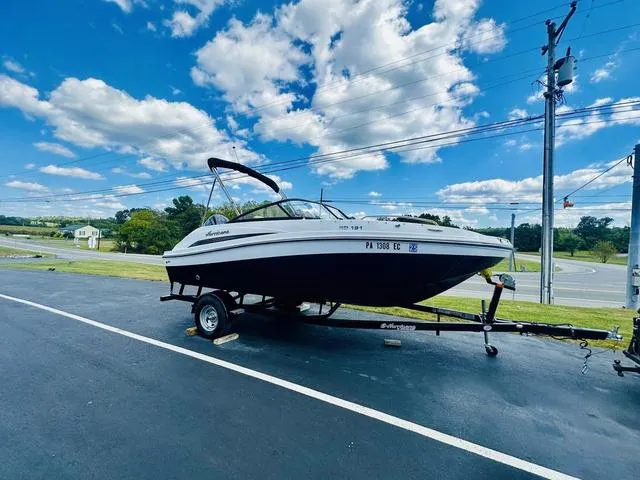 Slide: The Image of 2022 Hurricane SunDeck 191 OB boat on trailer under blue sky. - 4