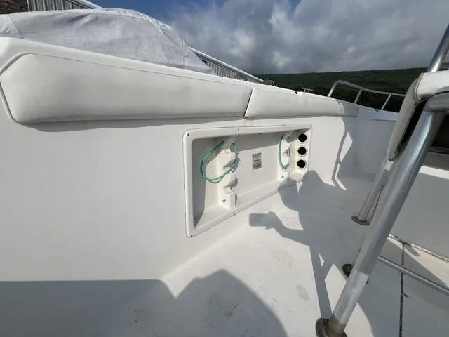 Slide: The Image of 2001 Carolina Skiff 2100 boat interior with storage compartment and seating. - 10