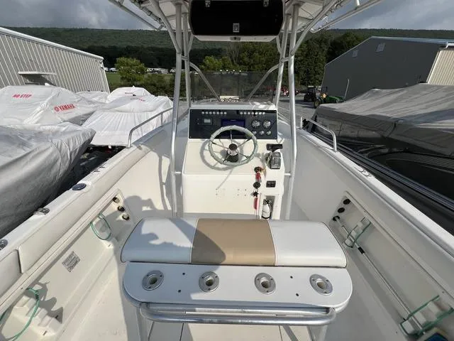 Slide: The Image of 2001 Carolina Skiff 2100 boat interior with steering console and seating. - 7