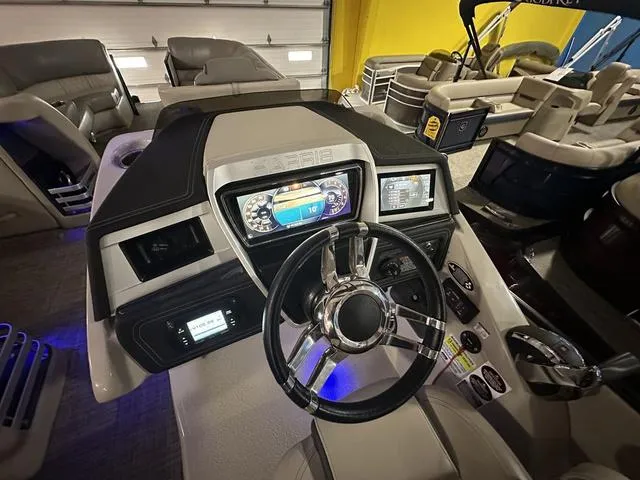 Slide: The Image of 2018 Harris Grand Mariner SEL 250 boat dashboard with modern controls and steering wheel. - 12