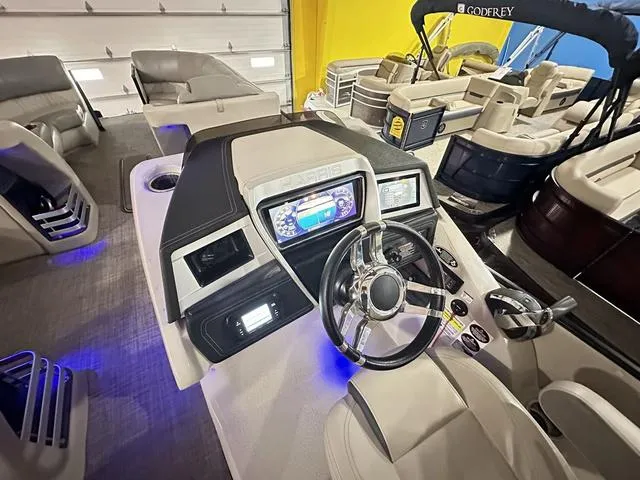 Slide: The Image of 2018 Harris Grand Mariner SEL 250 boat interior with modern dashboard and steering wheel. - 14