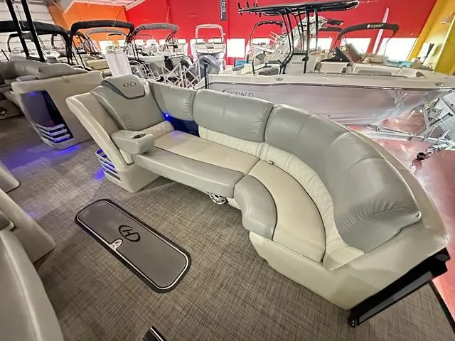 Slide: The Image of Luxurious seating on 2018 Harris Grand Mariner SEL 250 pontoon boat in showroom. - 17