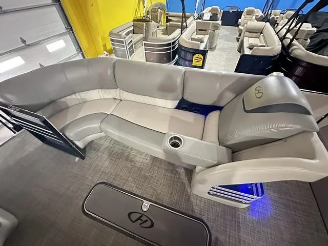 Slide: The Image of 2018 Harris Grand Mariner SEL 250 pontoon boat interior with plush seating and cup holder. - 18
