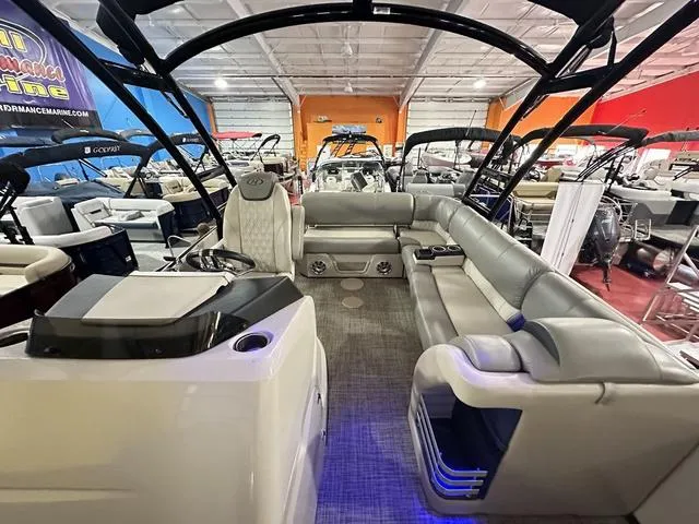 Slide: The Image of 2018 Harris Grand Mariner SEL 250 pontoon boat interior with luxurious seating in showroom. - 23