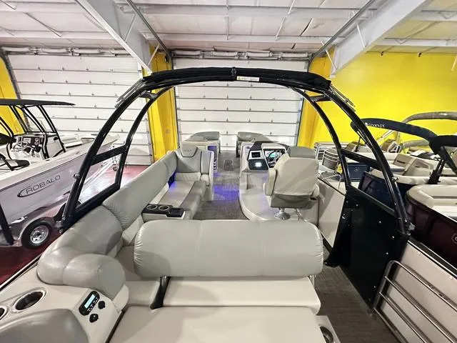 Slide: The Image of 2018 Harris Grand Mariner SEL 250 boat interior with plush seating and modern dashboard. - 31