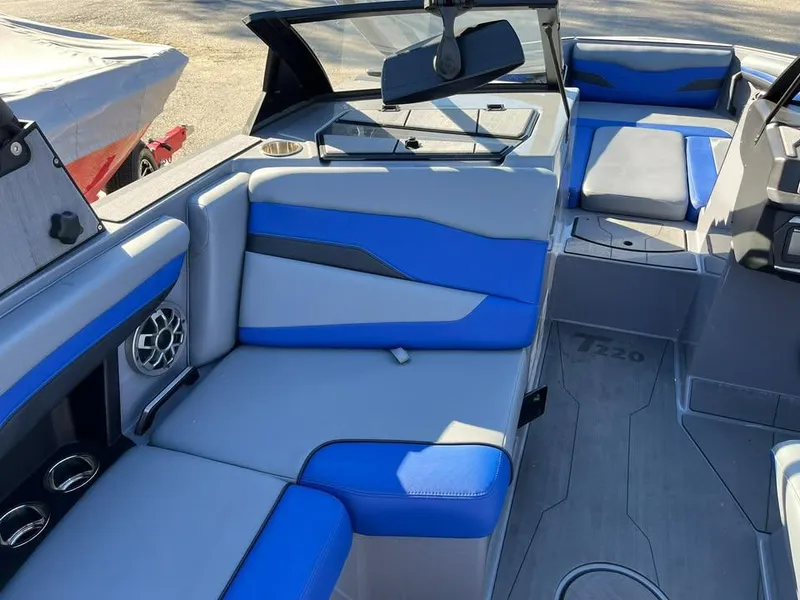 Slide: The Image of 2023 Axis T220 boat interior with blue and gray seating, modern design. - 7