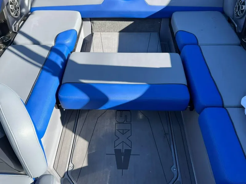 Slide: The Image of 2023 Axis T220 boat interior with blue and gray seating. - 8