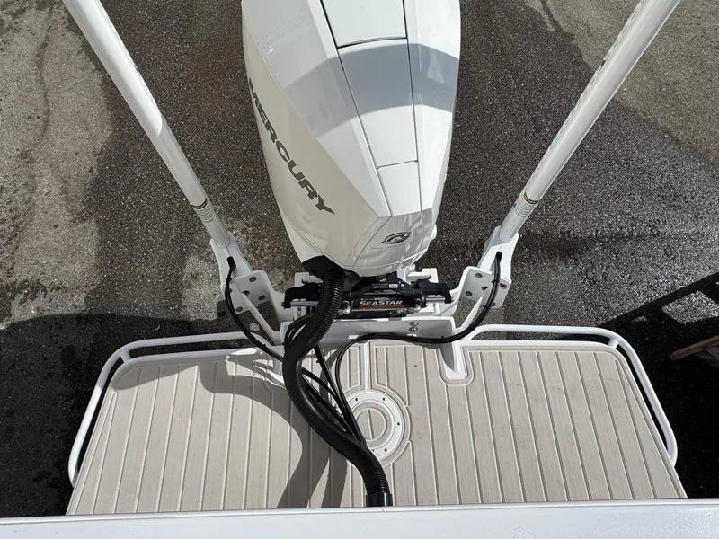 Slide: The Image of 1986 Mako 224 CC boat with Mercury outboard motor, viewed from above. - 4