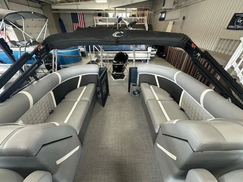 Slide: The Image of 2025 Crest Classic 220 SLC 3 Toon pontoon boat interior with gray seating and canopy. - 10