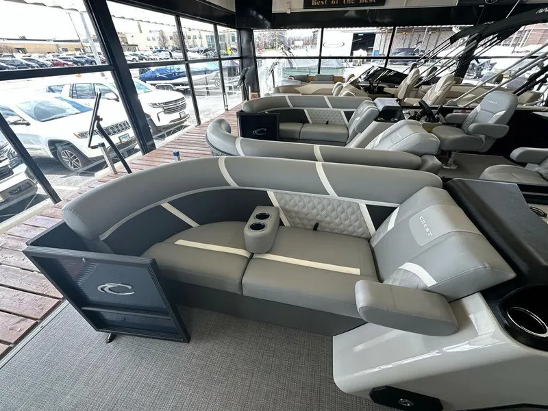 Slide: The Image of 2025 Crest Classic 220 SLC 3 Toon pontoon boat interior with gray seating and cup holders. - 4