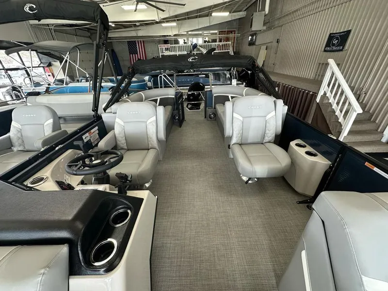 Slide: The Image of 2025 Crest Classic 220 SLC 3 Toon pontoon boat interior with luxurious seating and modern design. - 5