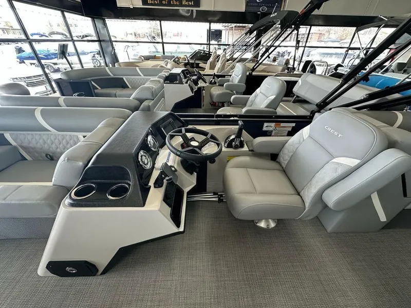 Slide: The Image of 2025 Crest Classic 220 SLC 3 Toon pontoon boat interior with luxurious seating and modern dashboard. - 6