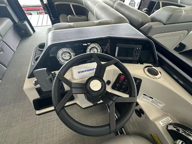 Slide: The Image of Interior view of 2025 Crest Classic 220 SLC 3 Toon boat dashboard. - 8