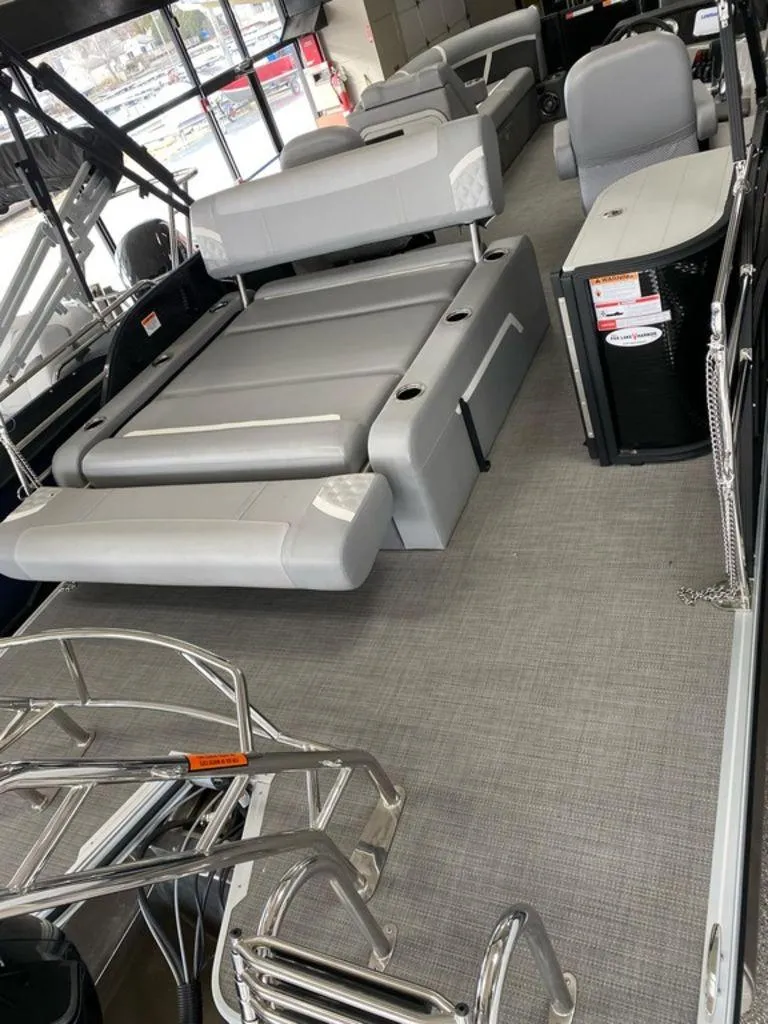 Slide: The Image of 2025 Crest Classic 220 SLSC 3 Toon interior with gray seating and modern design. - 5