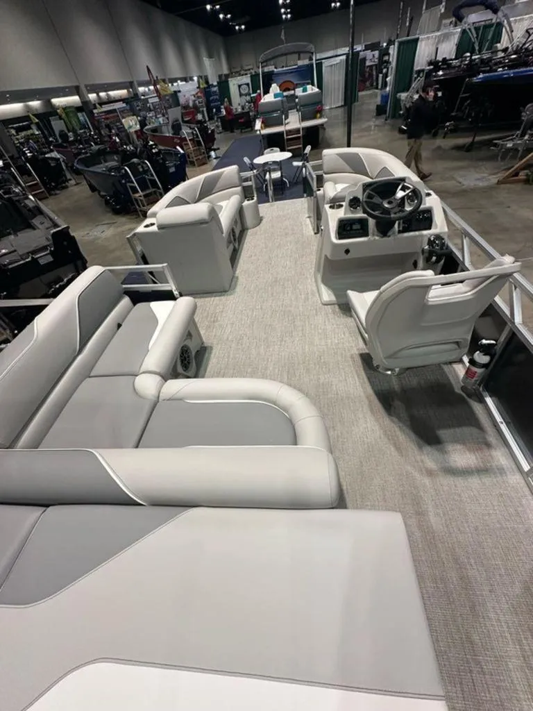 Slide: The Image of 2025 Avalon 2185 Venture CR pontoon boat interior at a showroom display. - 10