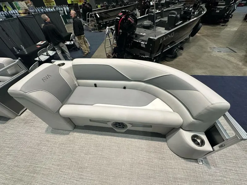Slide: The Image of Avalon 2185 Venture CR 2025 boat seat, gray upholstery, displayed at a boat show. - 3