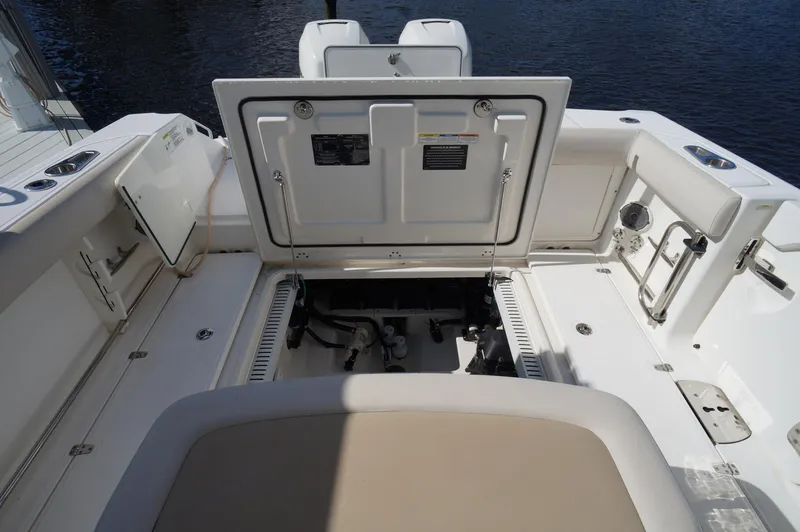 Slide: The Image of 2017 Boston Whaler 330 Outrage boat interior with open storage compartment. - 11