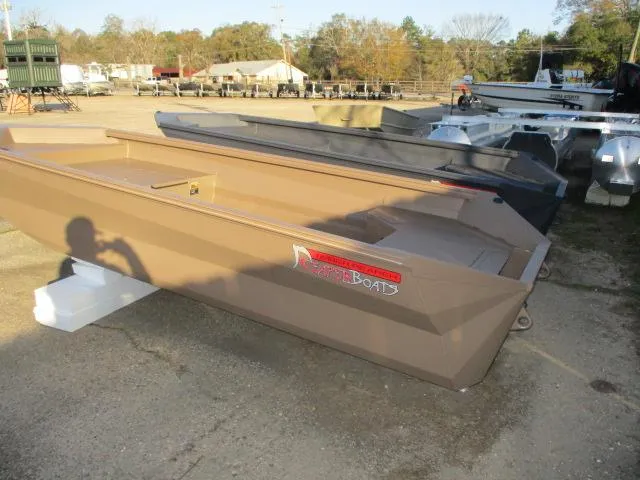 Slide: The Image of 2025 Reaper Boats model 553-1239 displayed outdoors in a boatyard. - 2