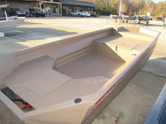Slide: The Image of 2025 Reaper Boats 553-1239 model, beige color, parked outdoors. - 3