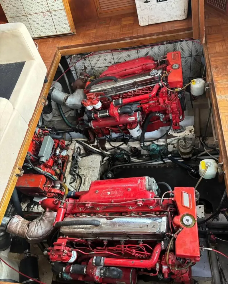 Slide: The Image of Engine room of a 1988 Marine Trader Trawler with red machinery. - 12